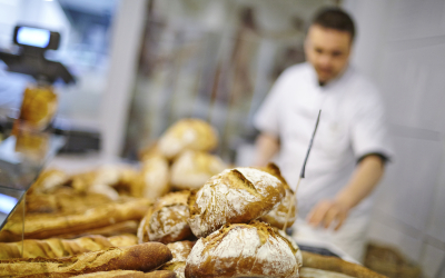 Traditional bread close up with baker at the backgorund